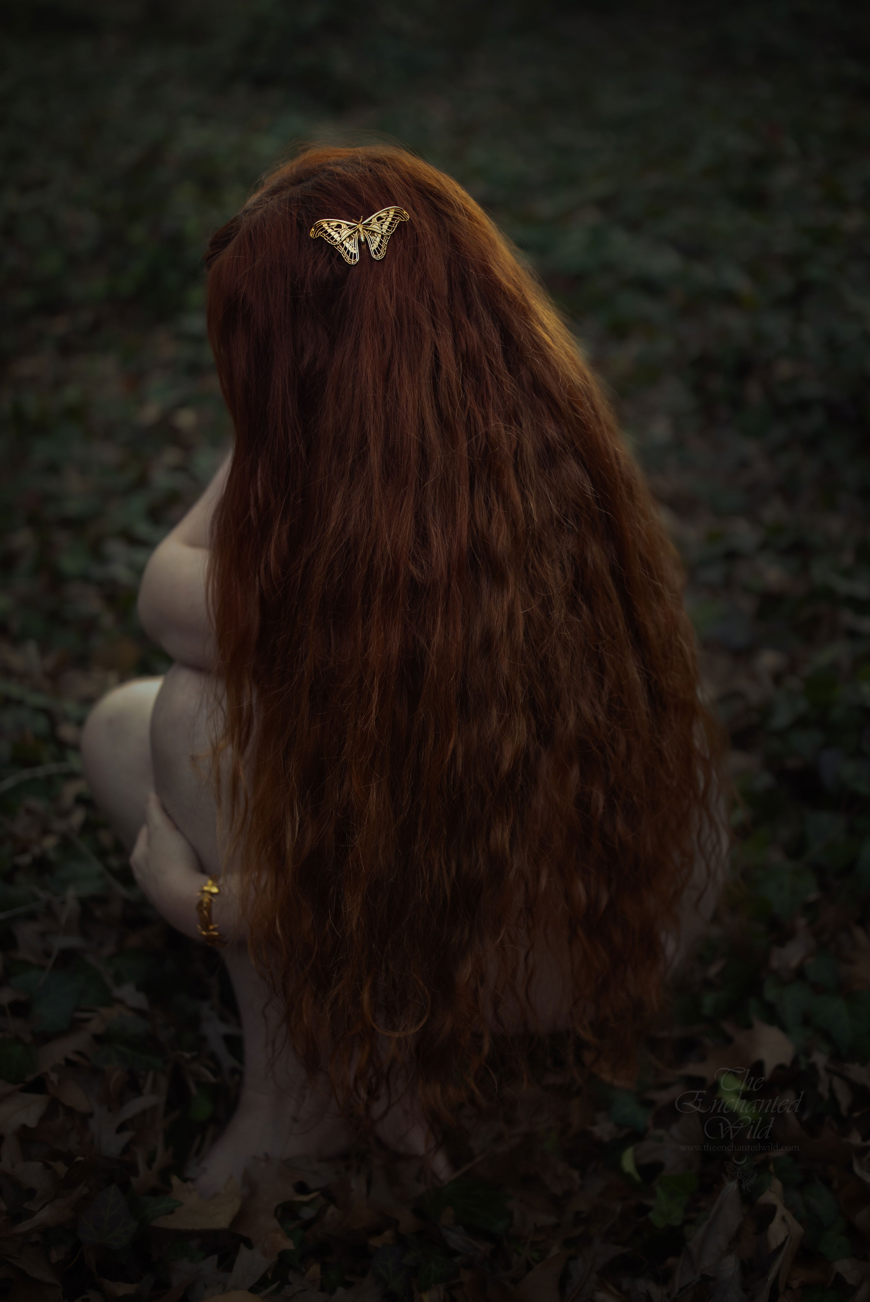 Girl with long hair wearing a nature-inspired moth hair comb – elegant accessory by Anna Reikher