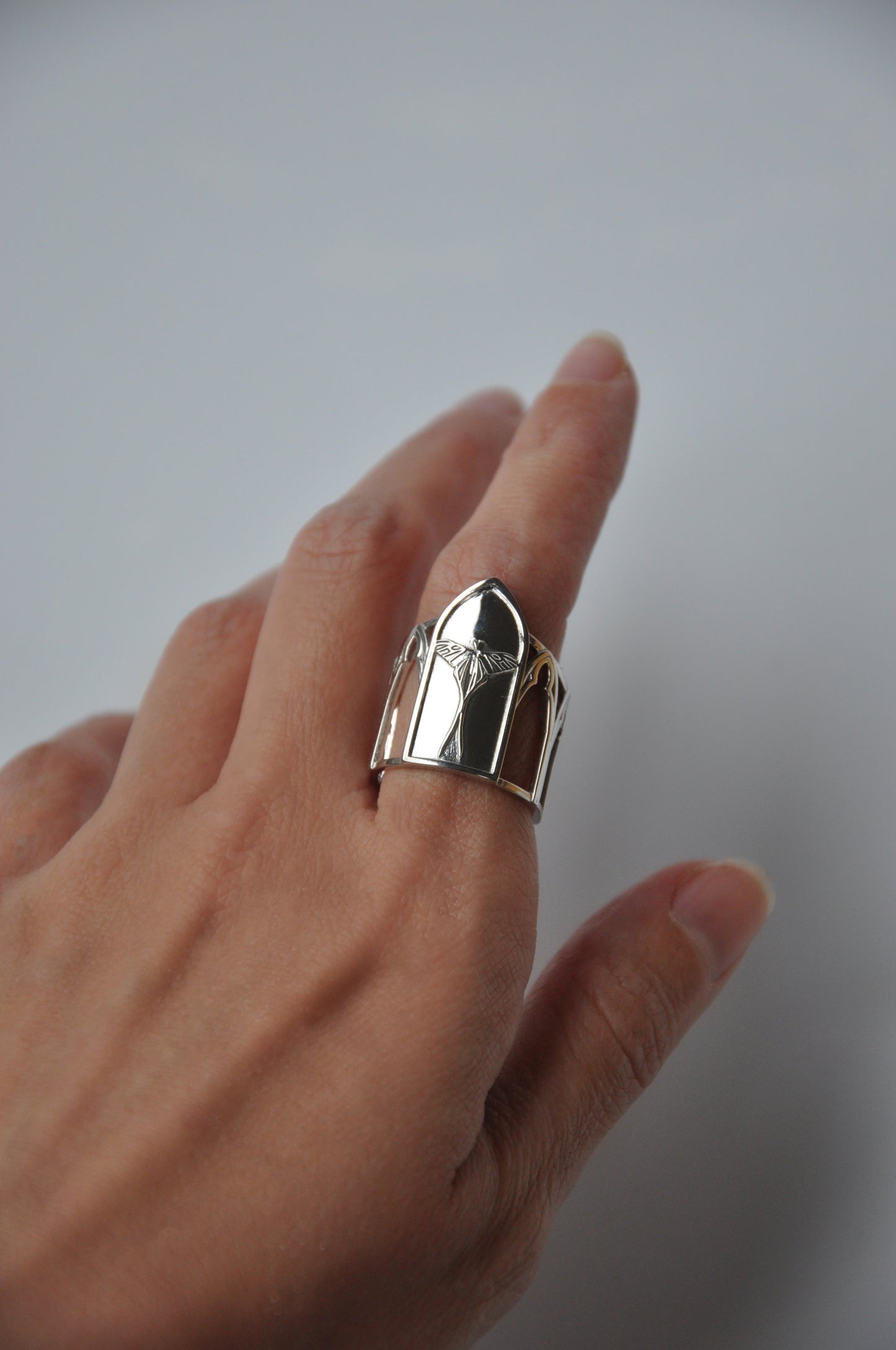 Side view of Sanctuary of Wings ring – silver Luna moth design with gothic arches and cathedral-inspired details by Anna Reikher