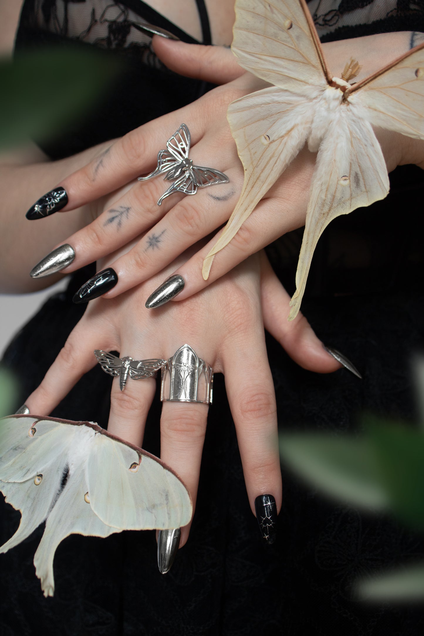 Sanctuary of Wings ring worn on hand – gothic cathedral-style silver ring with Luna moth design by Anna Reikher