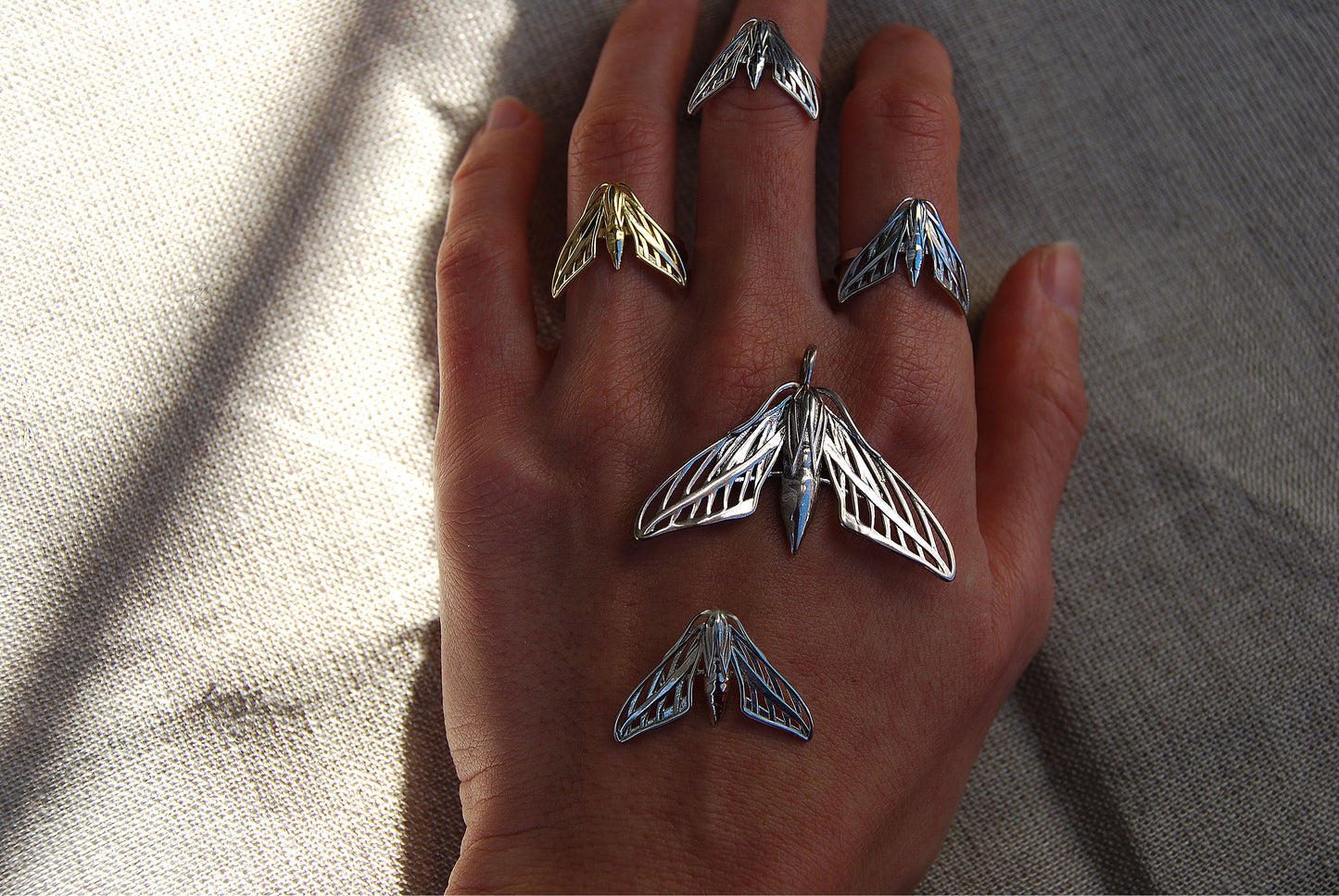 Gothic-style moth pendant necklace with antique finish