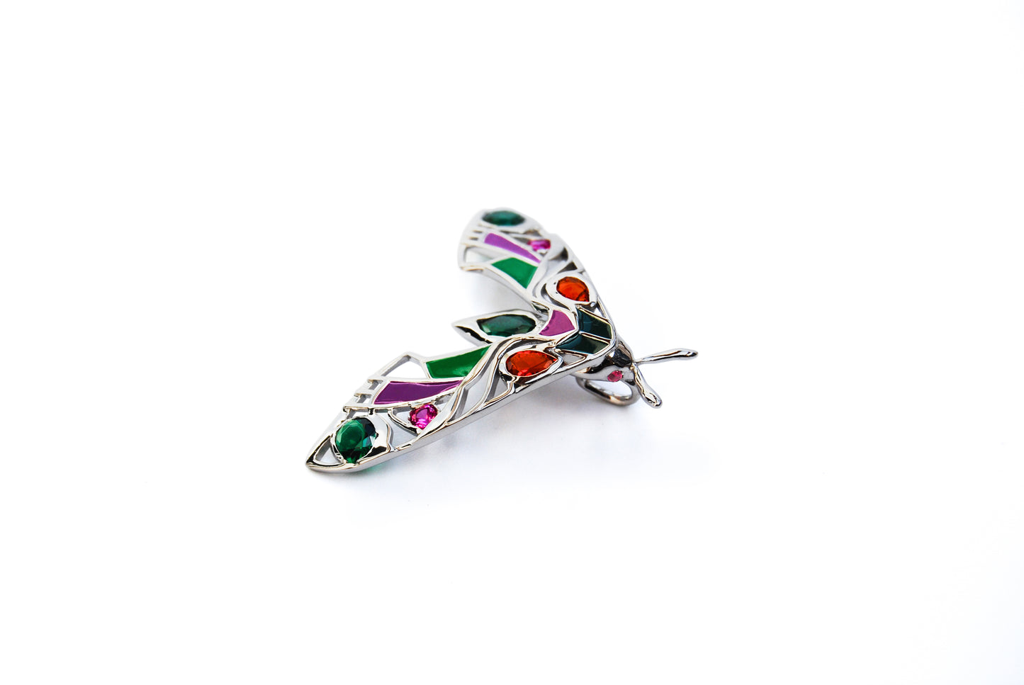 Horizontal view of silver moth pendant necklace on white background