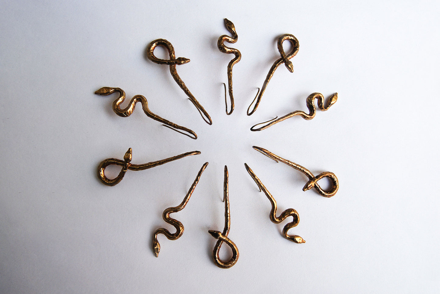 Asymmetrical snake drop earrings