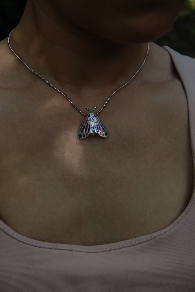 Model wearing the jeweled Tiger Moth pendant necklace