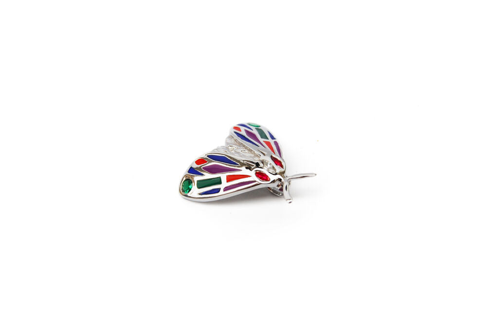 Side view of jeweled Tiger Moth pendant on white background