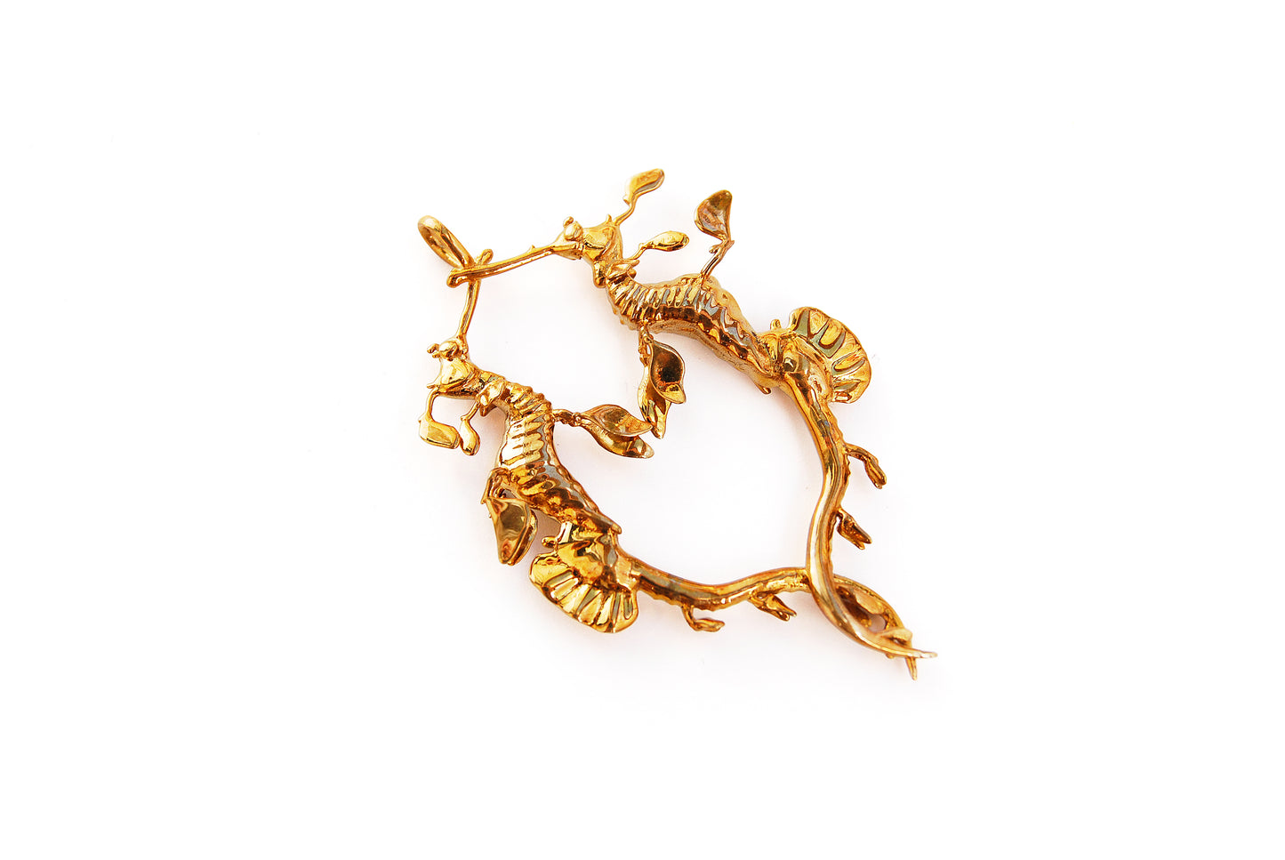 Horizontal view of gold Weedy Sea Dragon Pendant on white background, highlighting flowing silhouette.