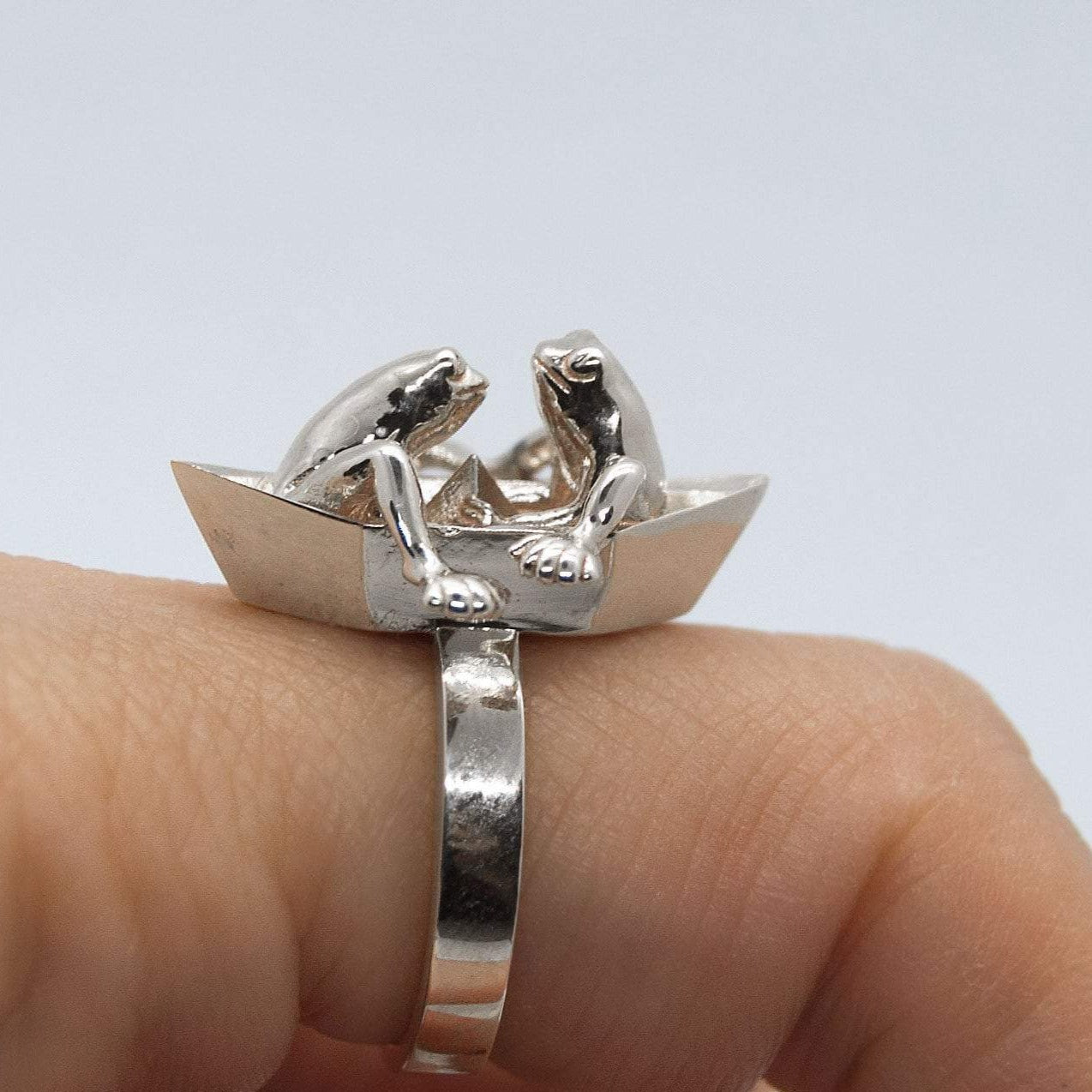 Frogs in origami boat ring