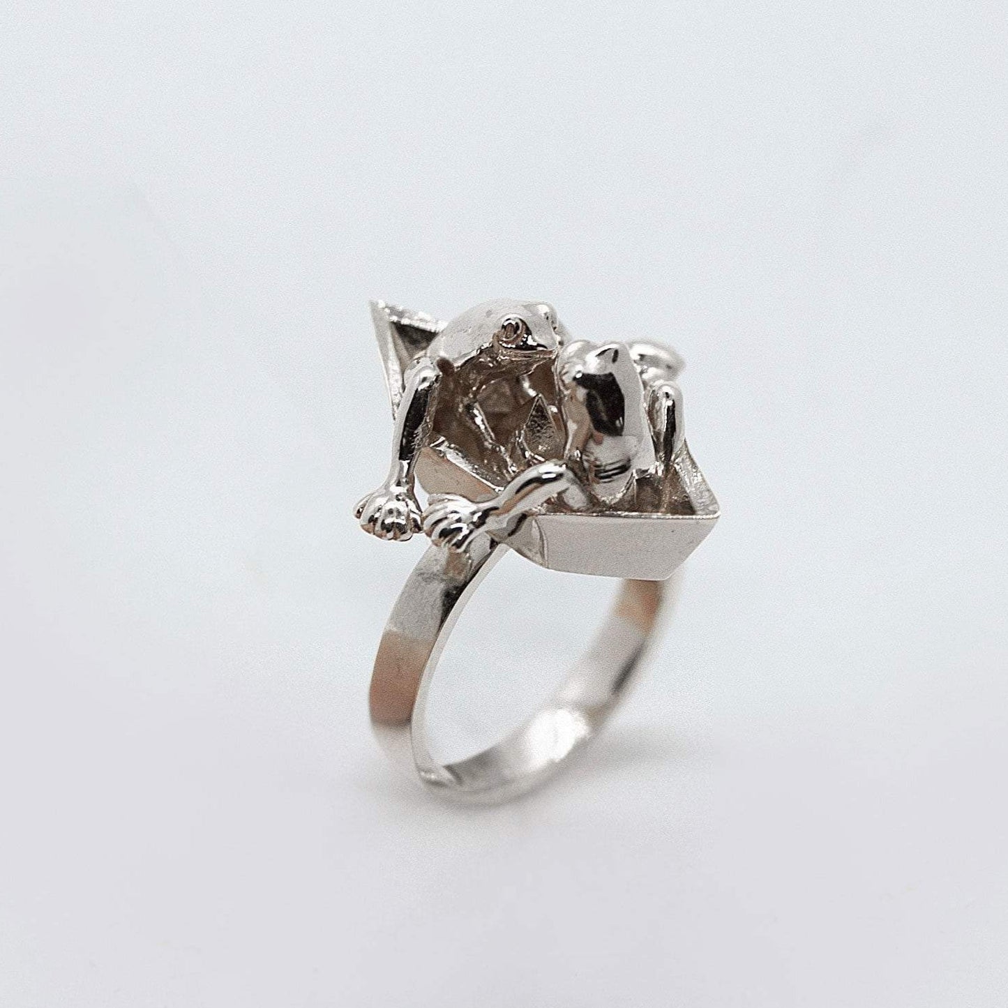 Frogs in origami boat ring