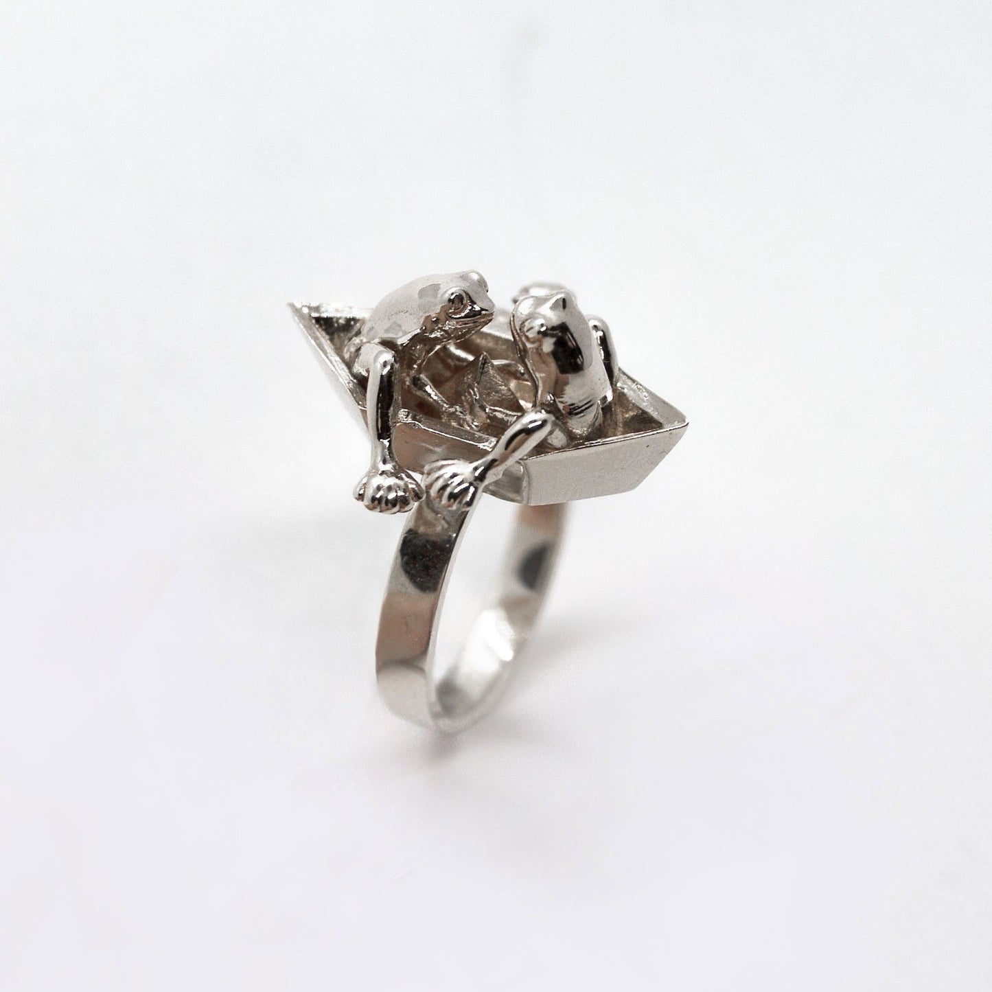 Frogs in origami boat ring