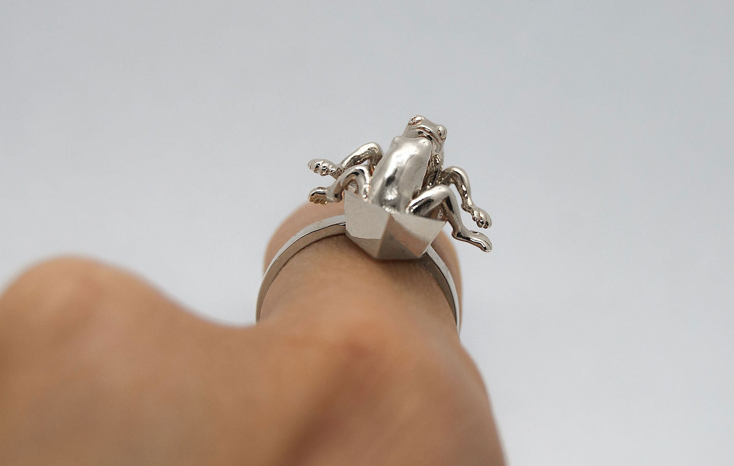 Frogs in origami boat ring