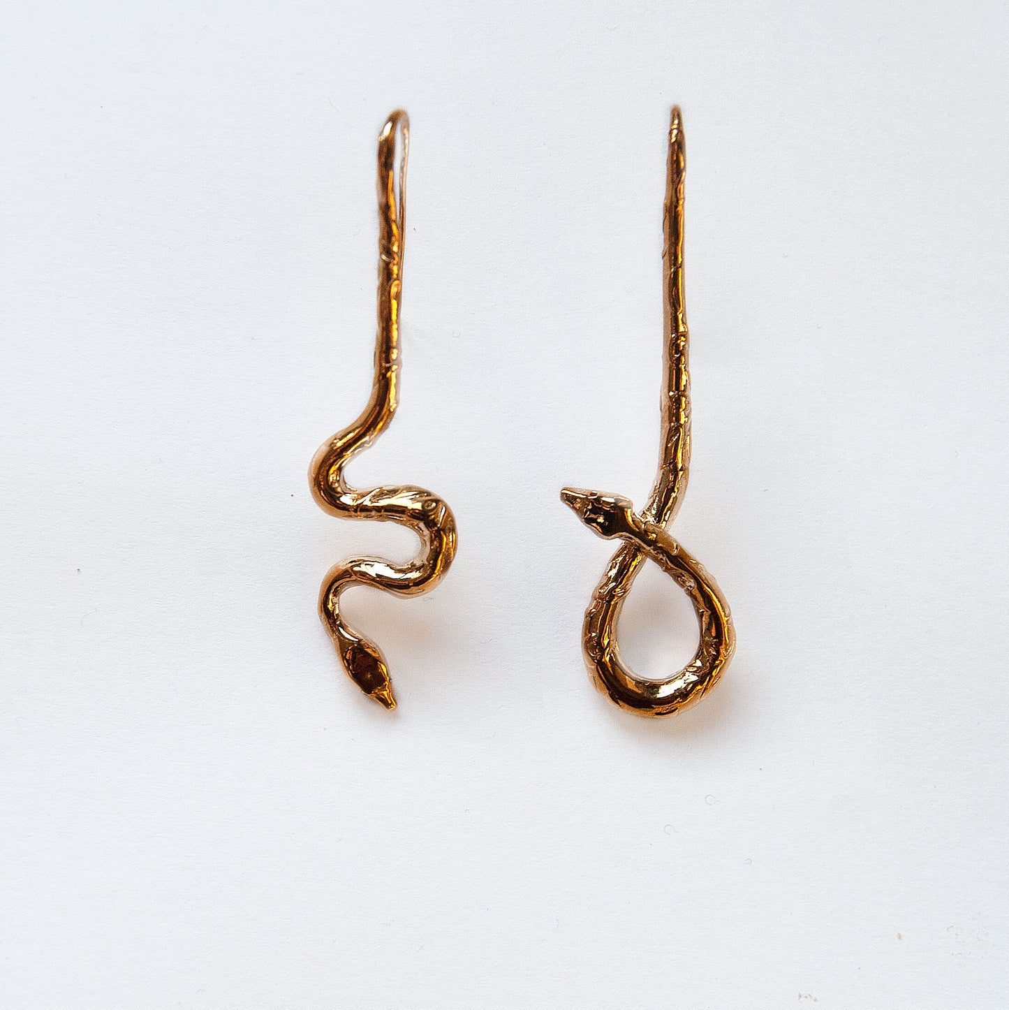 Asymmetrical snake drop earrings