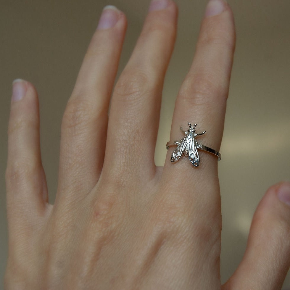 Sterling silver bumblebee ring highlighting delicate wing patterns under soft lighting