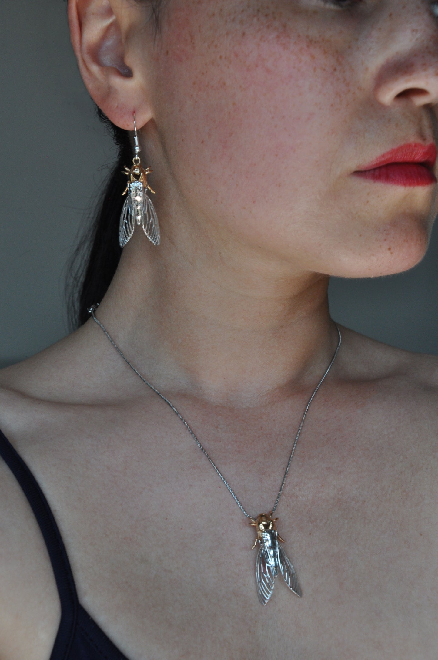 Nature-inspired cicada with shell pendant necklace, detailed silver insect jewelry
