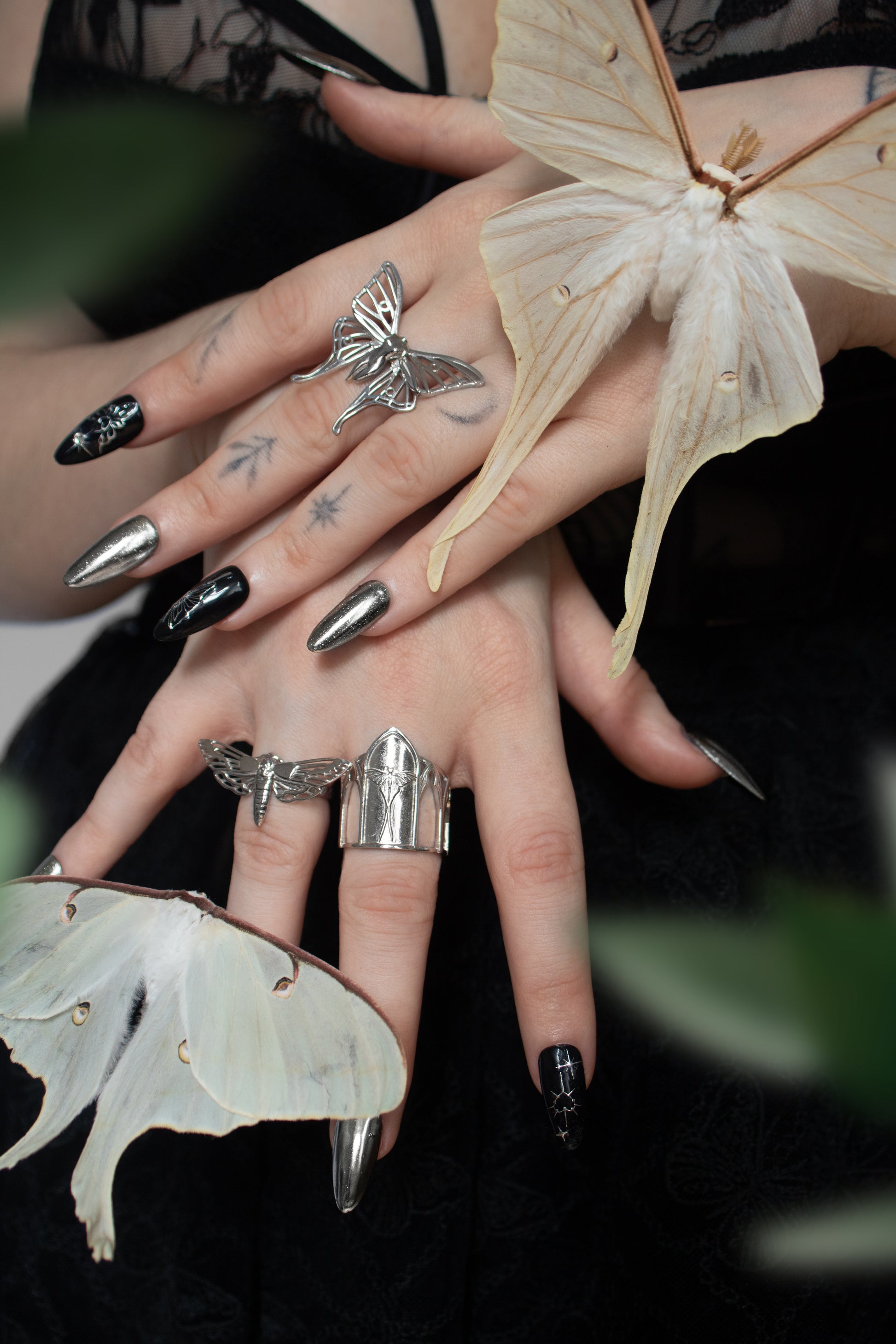 Sanctuary of Wings ring worn on hand – gothic cathedral-style silver ring with Luna moth design by Anna Reikher