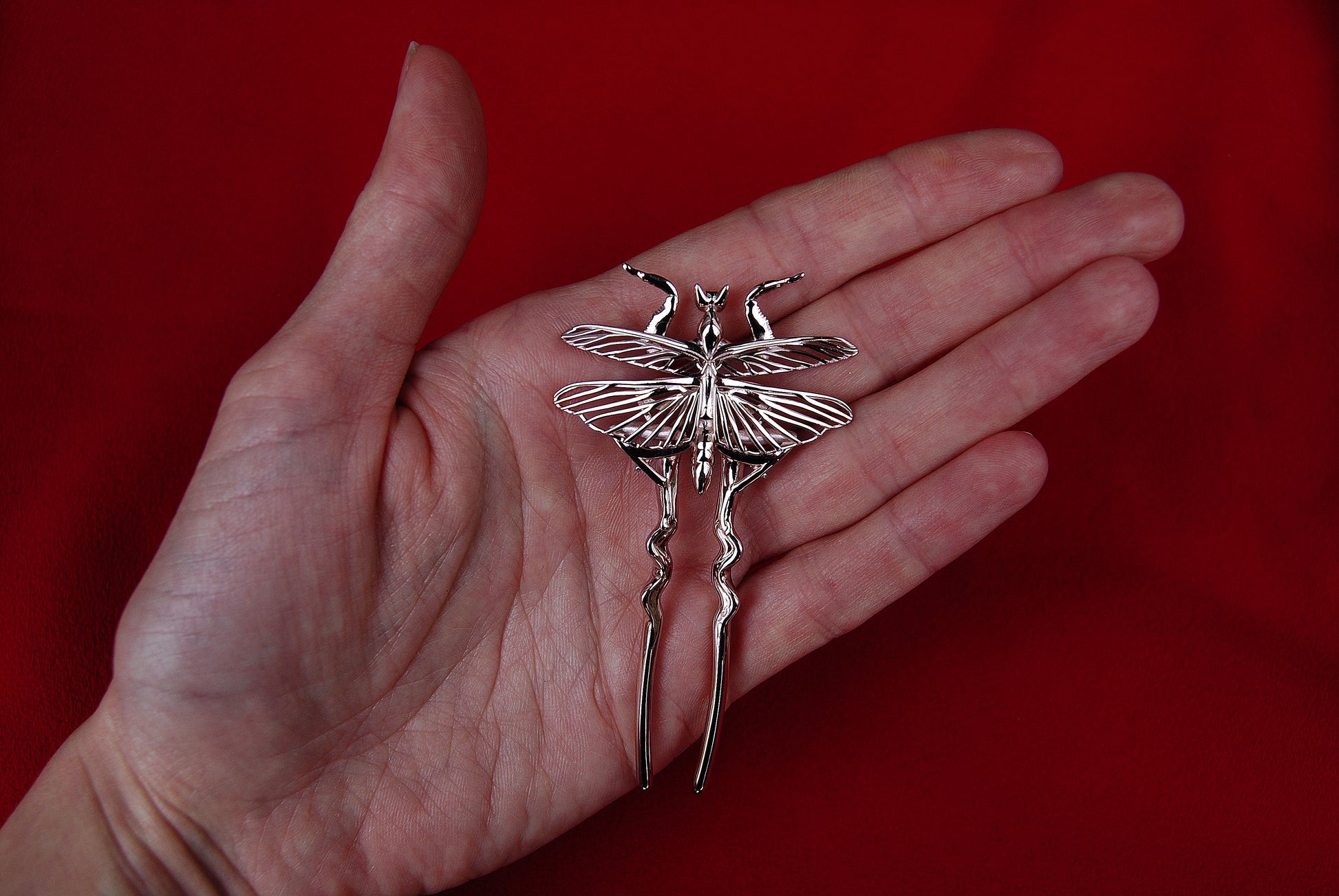Silver orchid mantis hair pin with delicate wing details