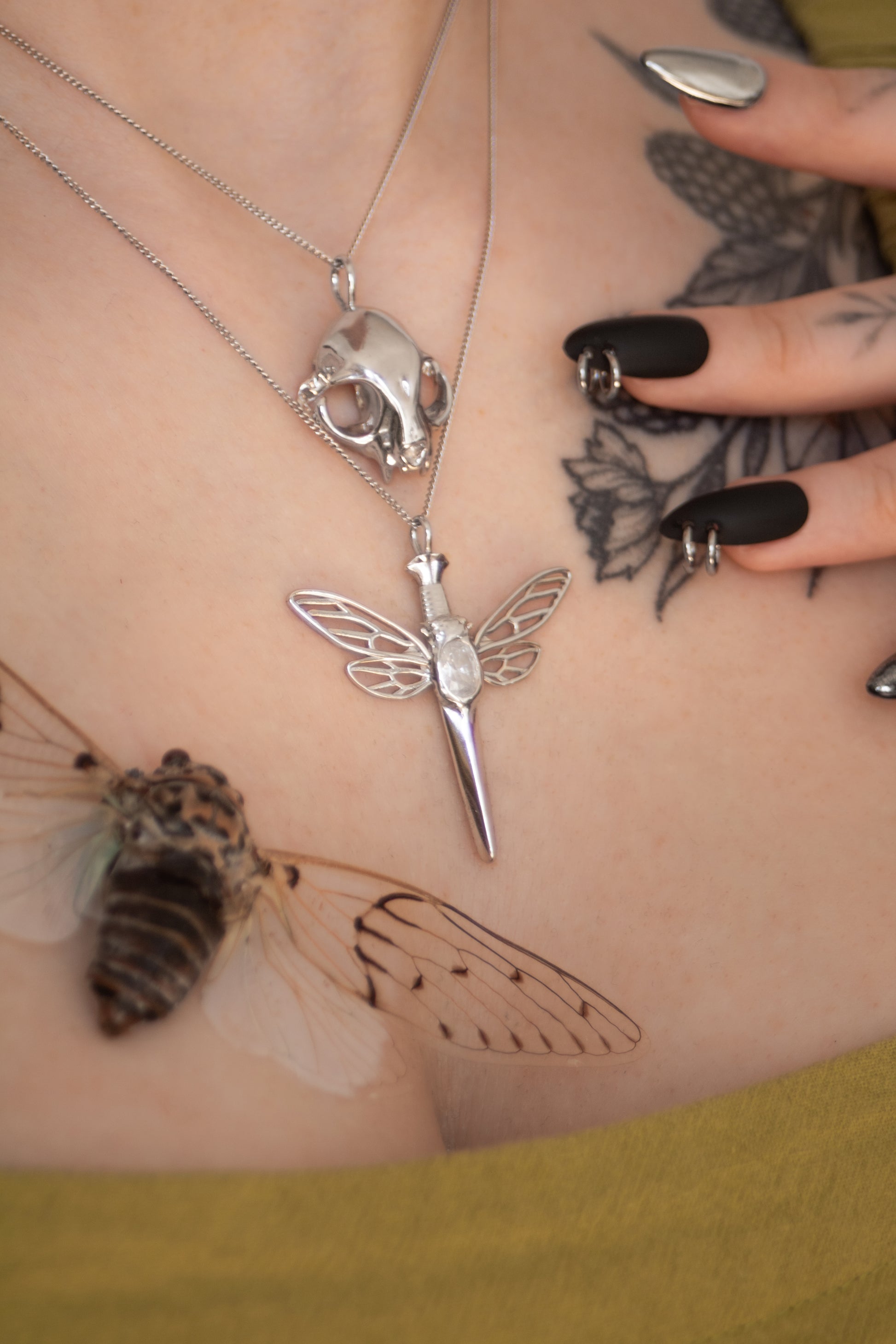 925 sterling silver cicada dagger relic pendant featuring detailed insect design and glowing white accent stone