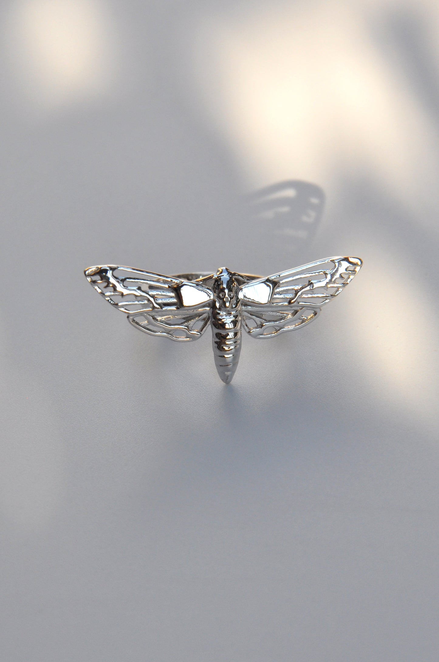 Close-up of the Death’s-Head Hawk Moth Ring in silver, showcasing intricate gothic detailing.