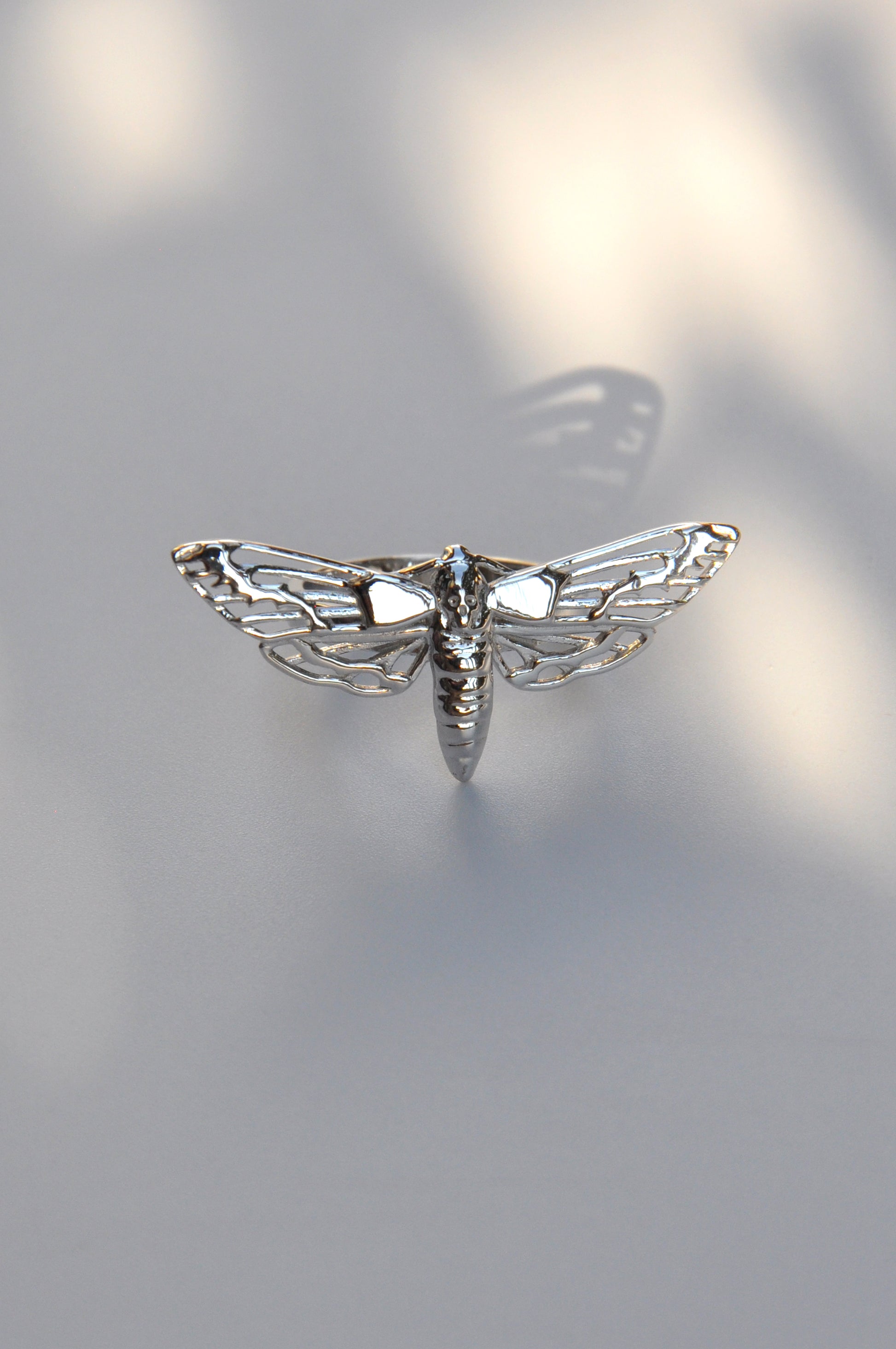 Close-up of the Death’s-Head Hawk Moth Ring in silver, showcasing intricate gothic detailing.