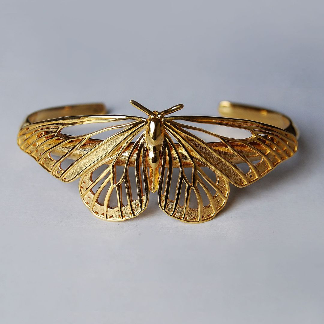 Front view of gold Monarch Butterfly Bracelet on white background, showing full butterfly silhouette and elegant cut-outs.