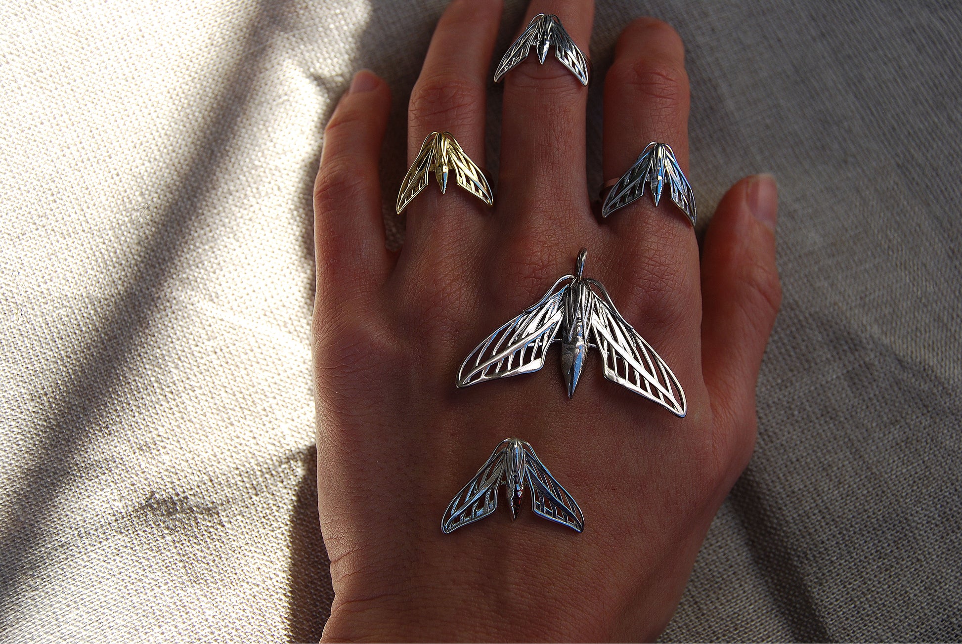 Gothic-style moth pendant necklace with antique finish