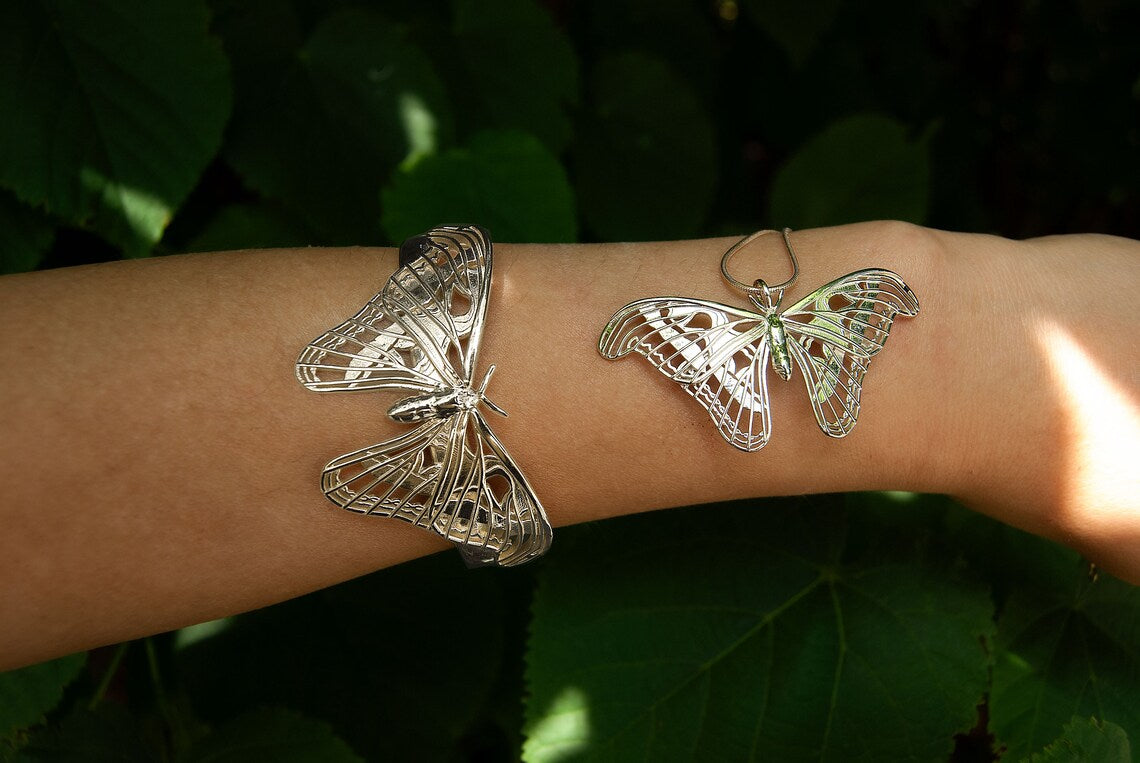 Atlas Moth Pendant and Bracelet in sterling silver worn together, showcasing elegant insect jewelry styling.