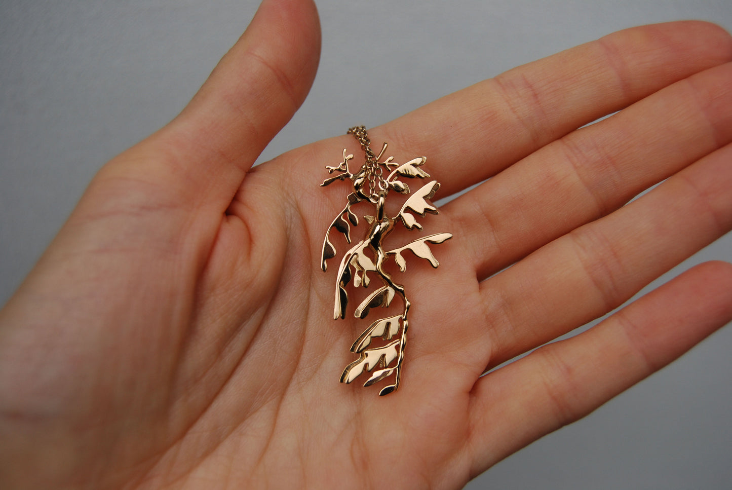 Back view of 14K gold plated Leafy Sea Dragon Pendant, showing polished ocean-inspired detail.