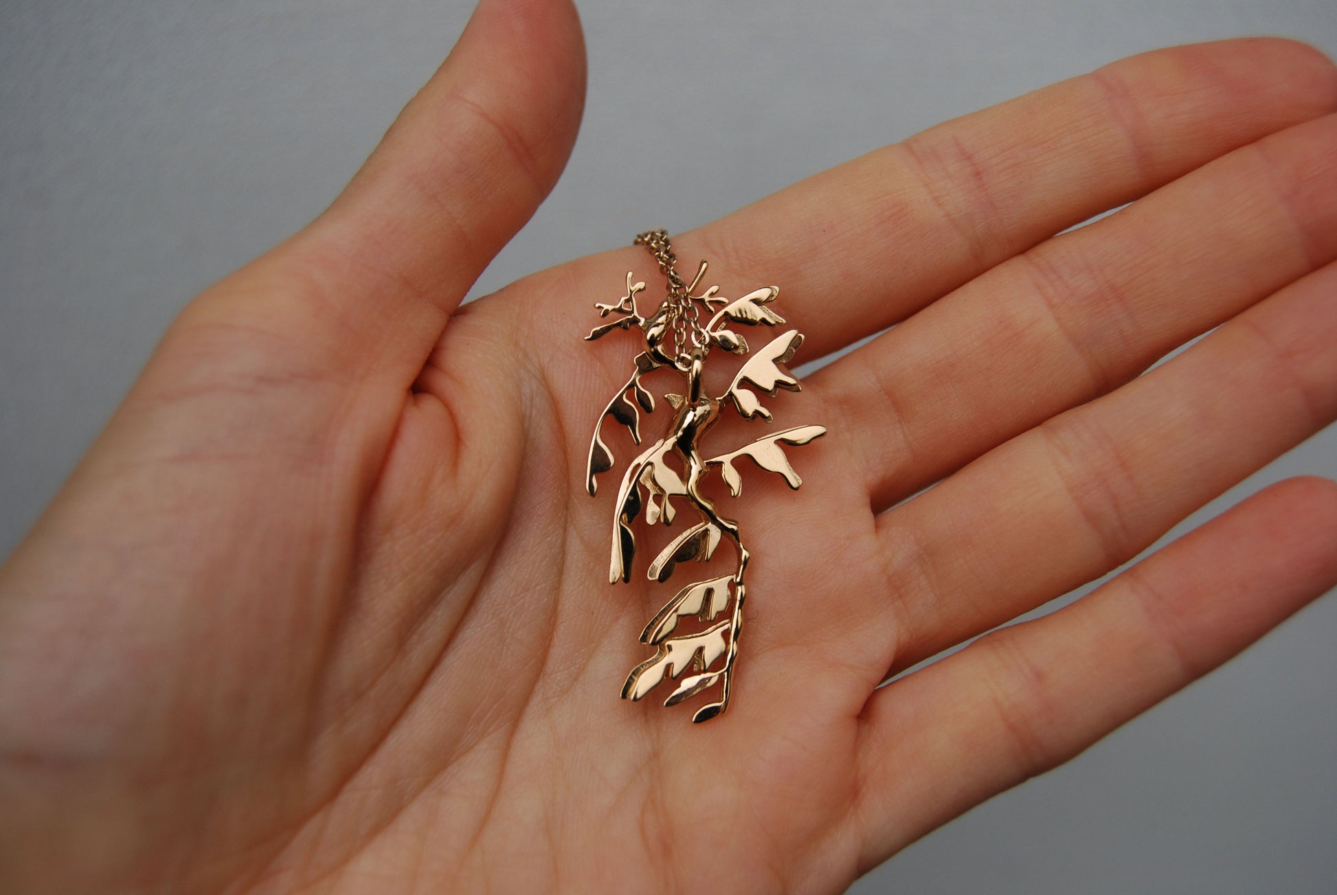 Back view of 14K gold plated Leafy Sea Dragon Pendant, showing polished ocean-inspired detail.