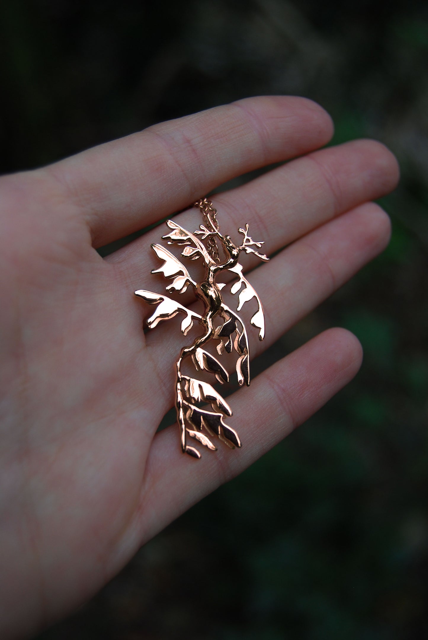 Front view of Leafy Sea Dragon Pendant in 14K rose gold plated finish, elegant marine jewelry.