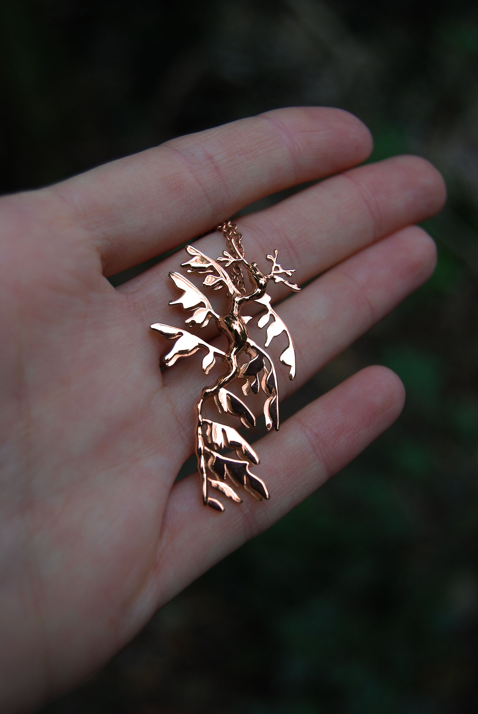 Front view of Leafy Sea Dragon Pendant in 14K rose gold plated finish, elegant marine jewelry.