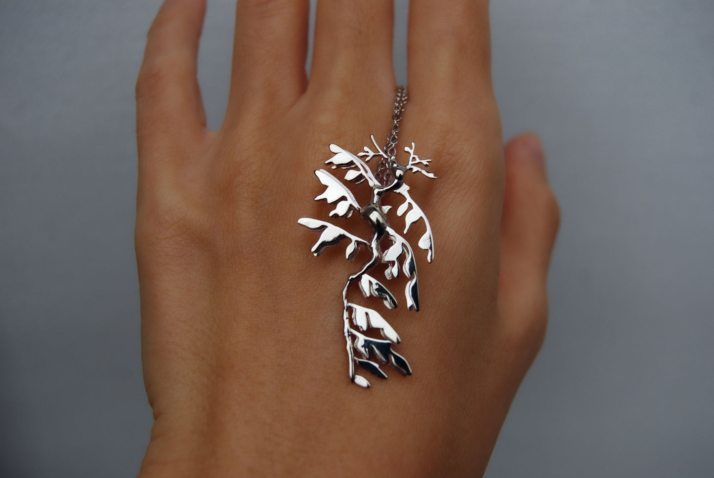 Front view of Leafy Sea Dragon Pendant in sterling silver, featuring intricate sea creature design.