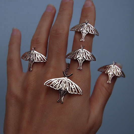 Silver Luna Moth Ring worn on hand with pendant, showing detailed moth wing design and elegant fit.