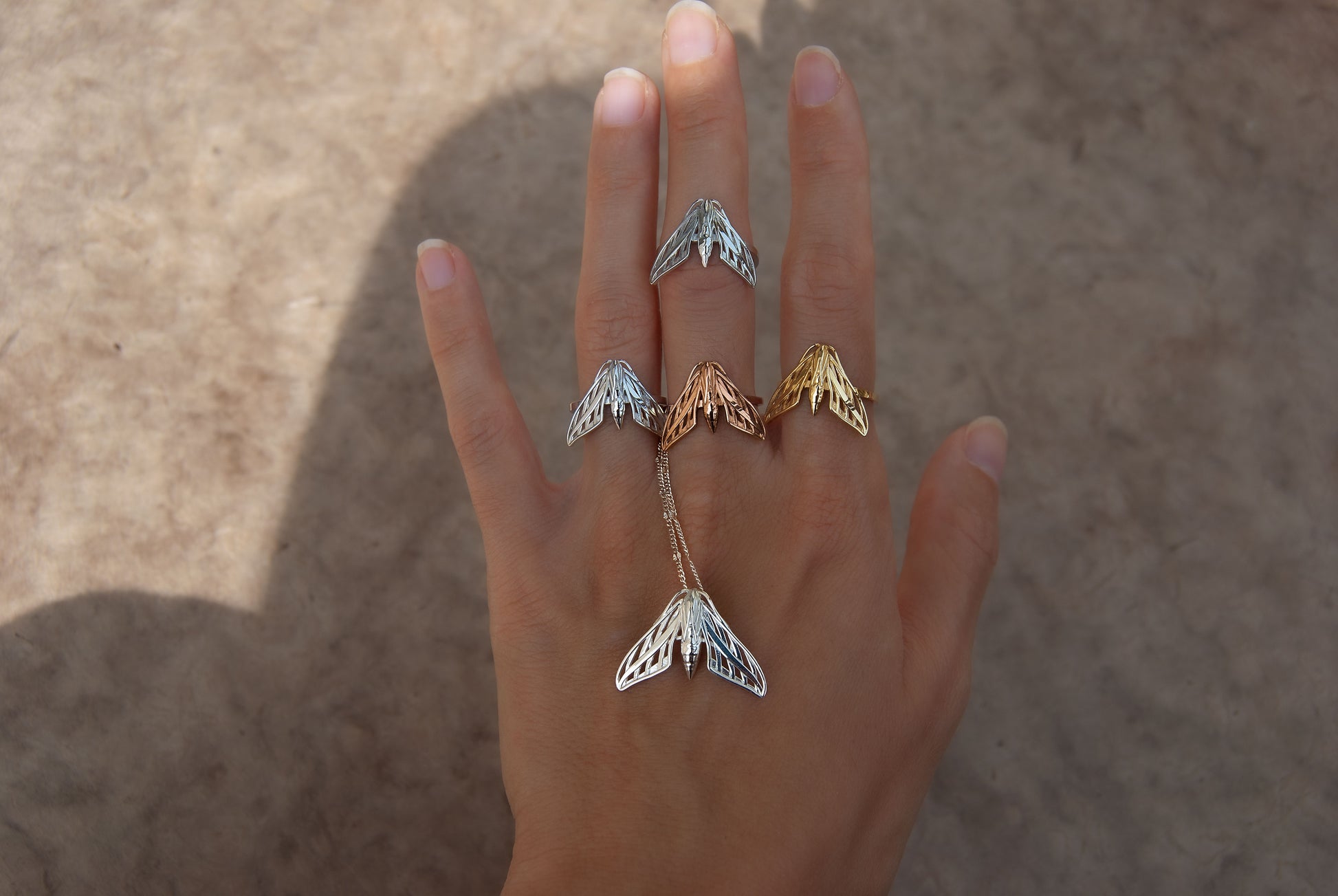 Mystical collection of sphinx moth jewelry in gold and silver tones