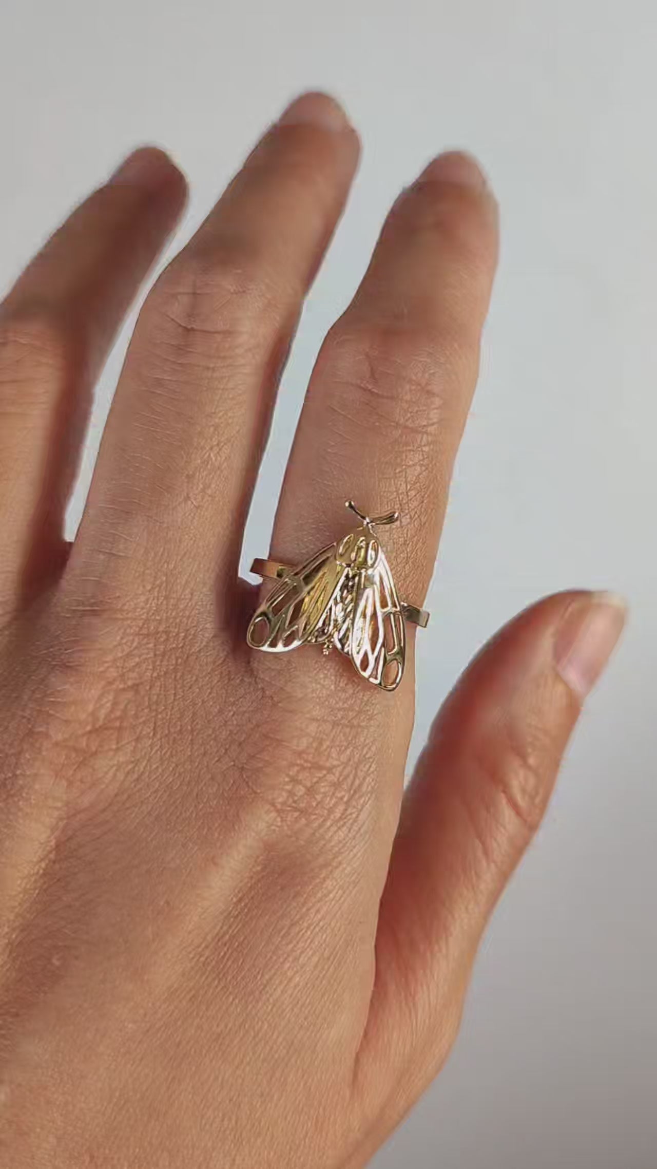Video showing Tiger Moth Ring in 14K gold plated finish worn on hand, highlighting insect-inspired jewelry.