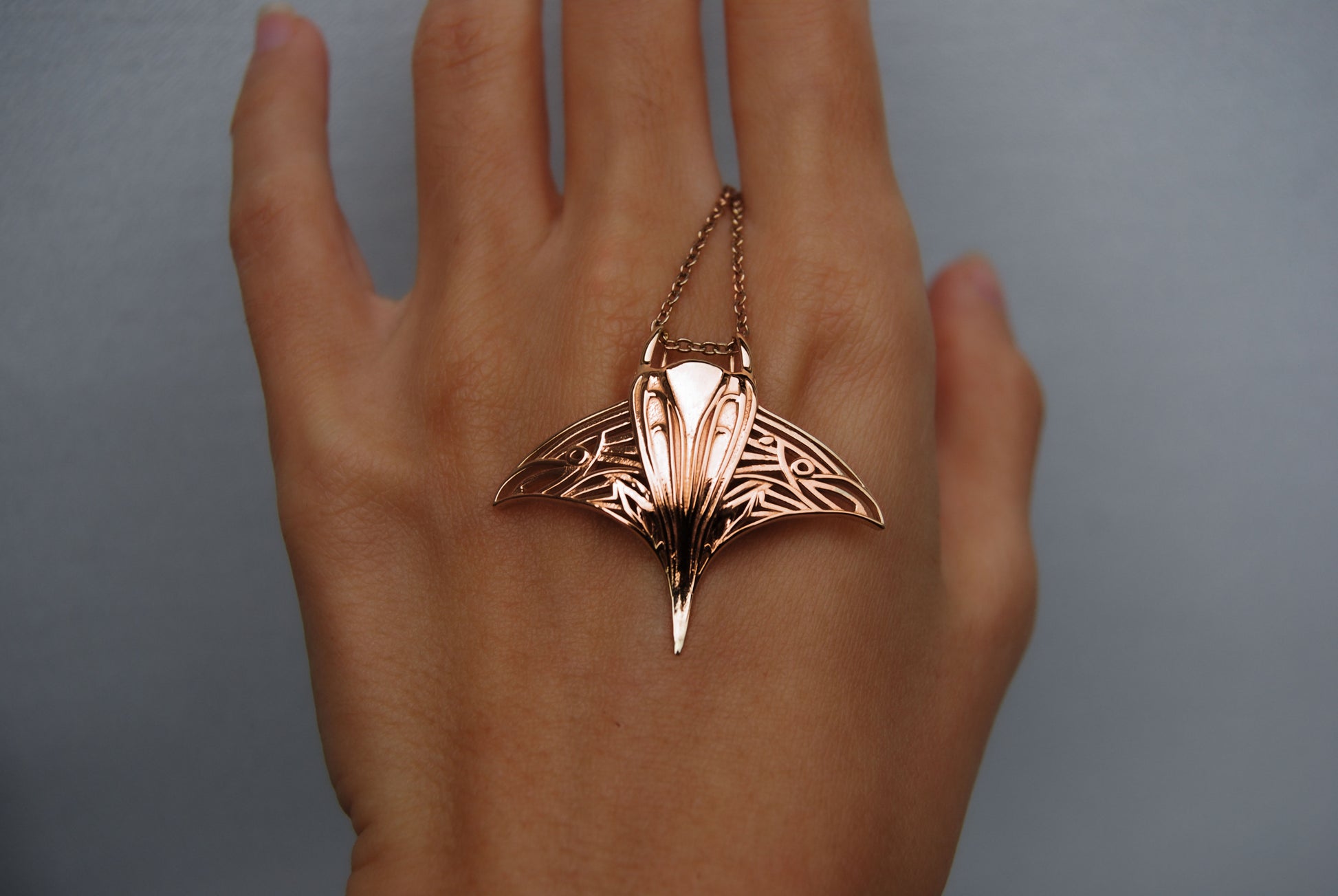 14K rose gold-plated manta ray pendant, a warm-toned marine life necklace.