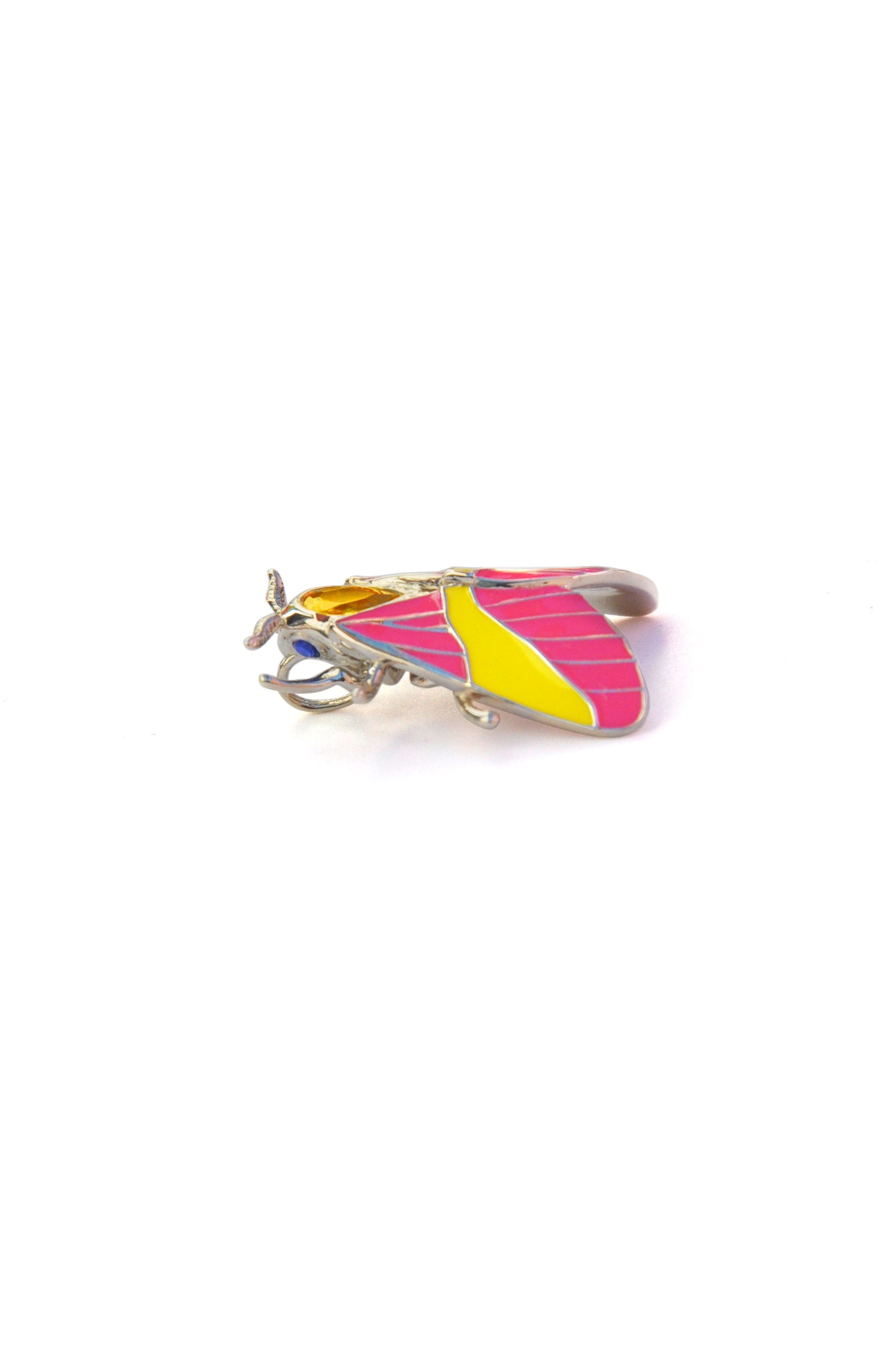 Left side view of Rosy Maple Moth pendant showing enamel wings and yellow crystal detail