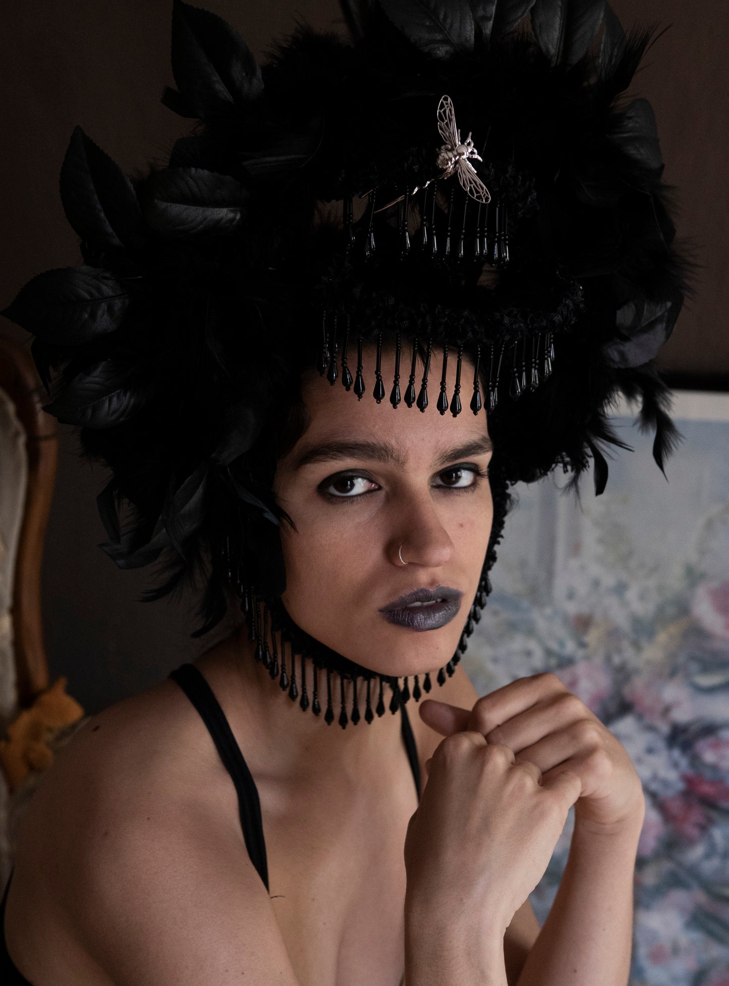 Model in dark fantasy costume wearing a silver bee hair pin, showcasing handcrafted insect-inspired jewelry with ethereal styling.