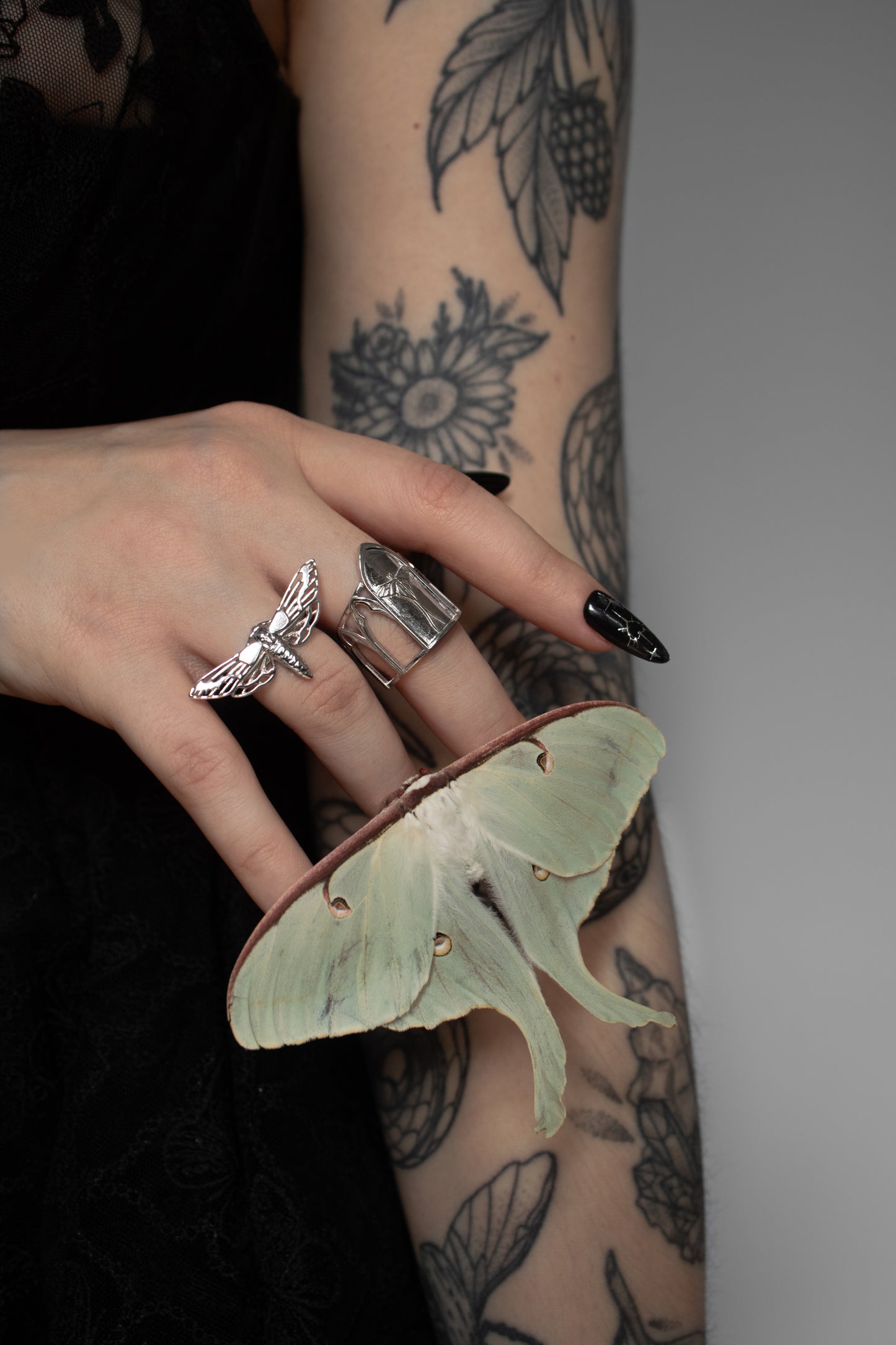 Full look of a model styled with the silver Death’s-Head Hawk Moth Ring, part of a gothic fashion ensemble.