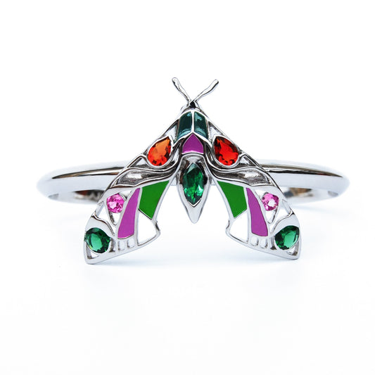 Front view of silver Pandora moth cuff bracelet on white background