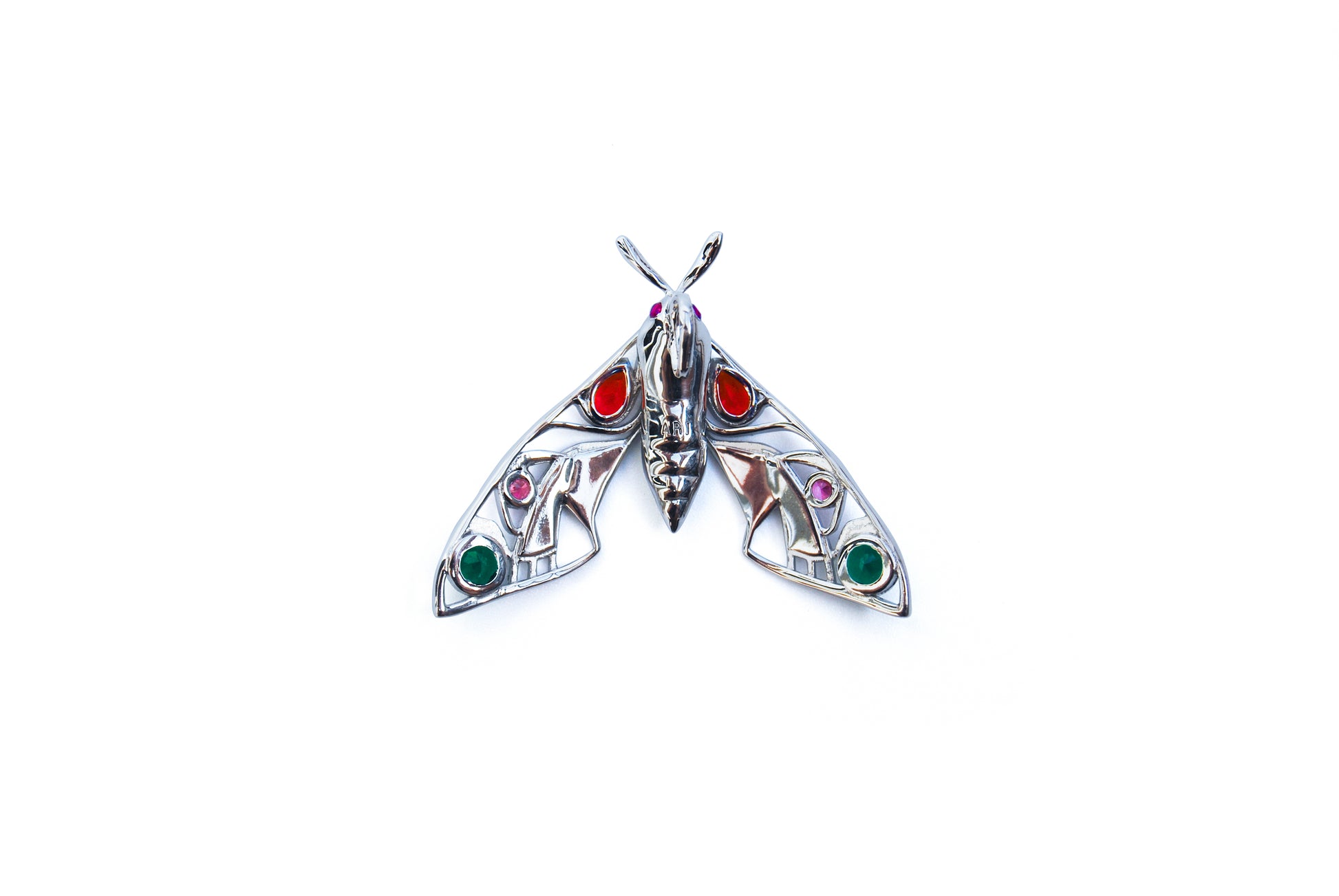 Back view of silver moth pendant necklace on white background