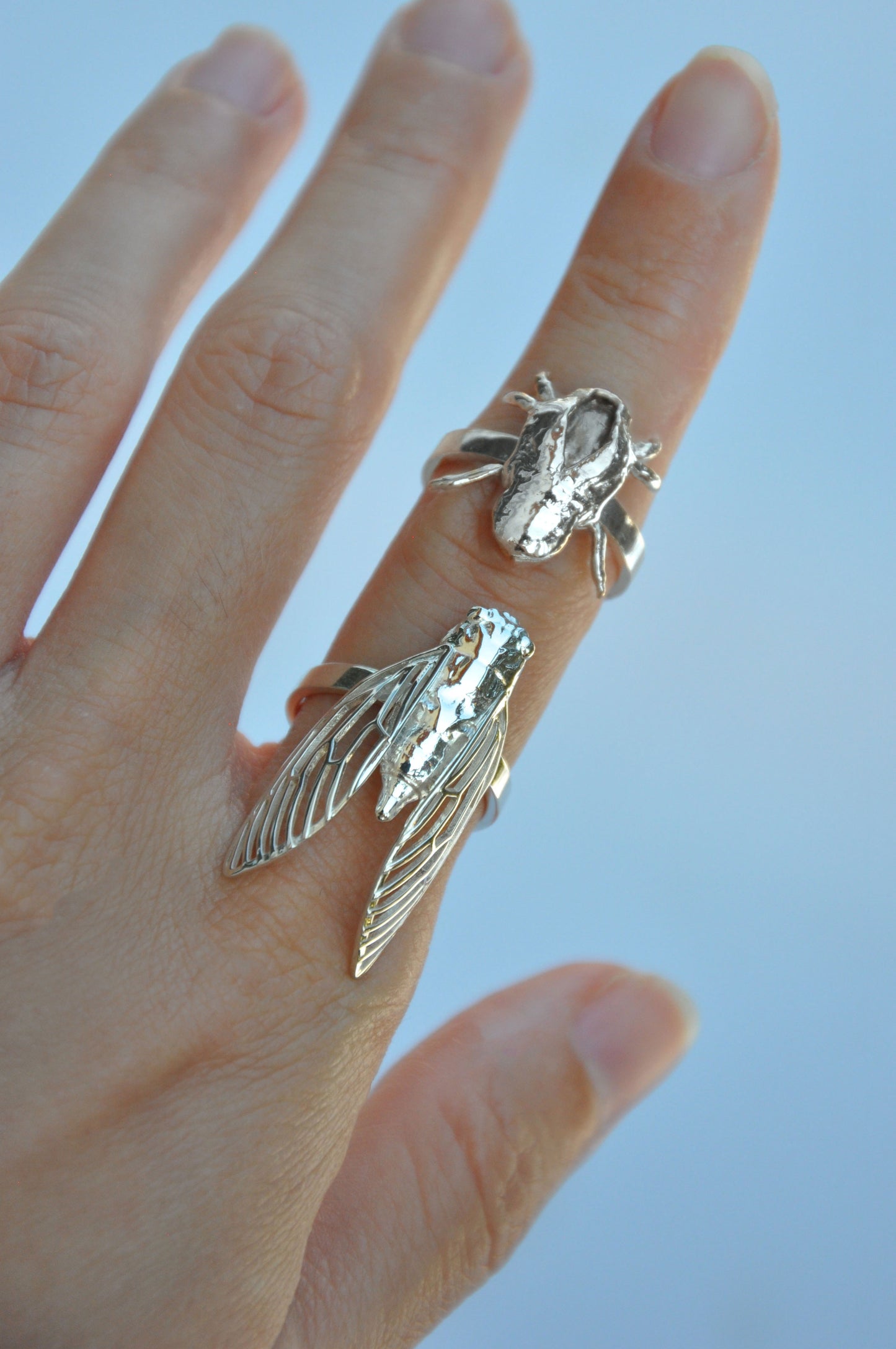 Wearing cicada and cicada shell stacking rings, handcrafted silver rings