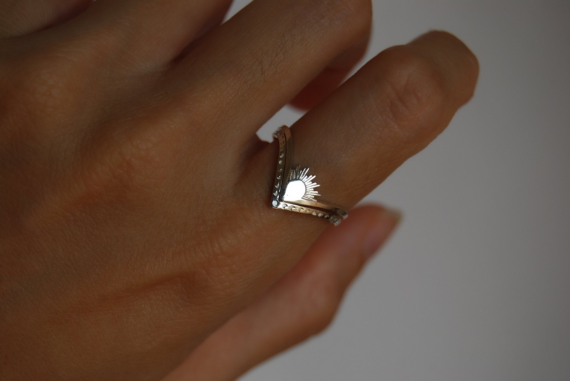 Alternate view of sun, moon, and moth rings stacked together, showcasing intricate celestial and insect details.