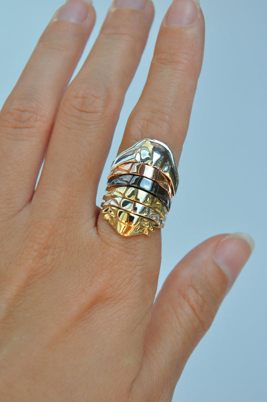 Front view of trilobite stacking rings with segmented rainbow finish – unique fossil accessories and paleo-inspired jewelry.