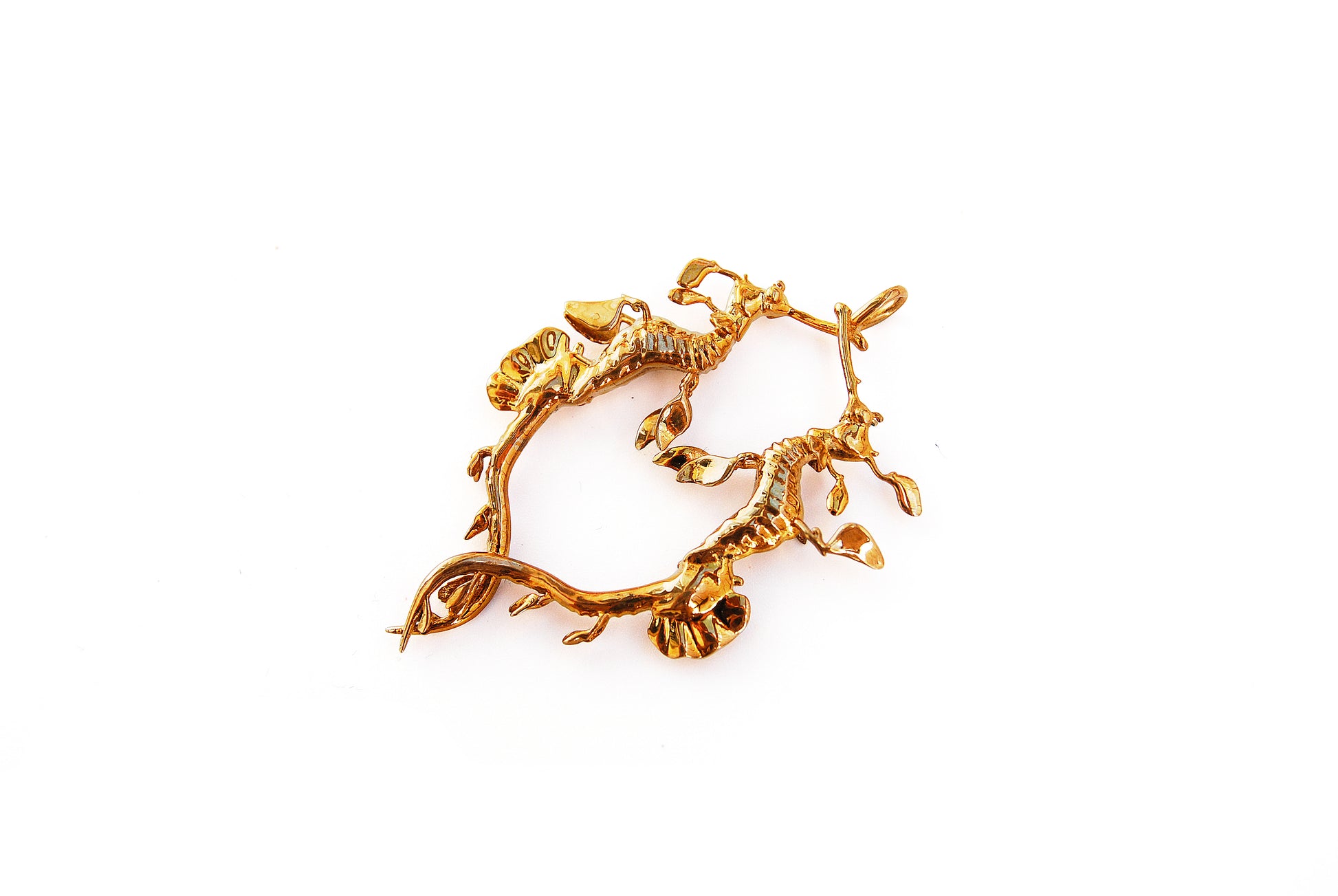 Left side angle of gold Weedy Sea Dragon Pendant on white, showing layered sea dragon forms.