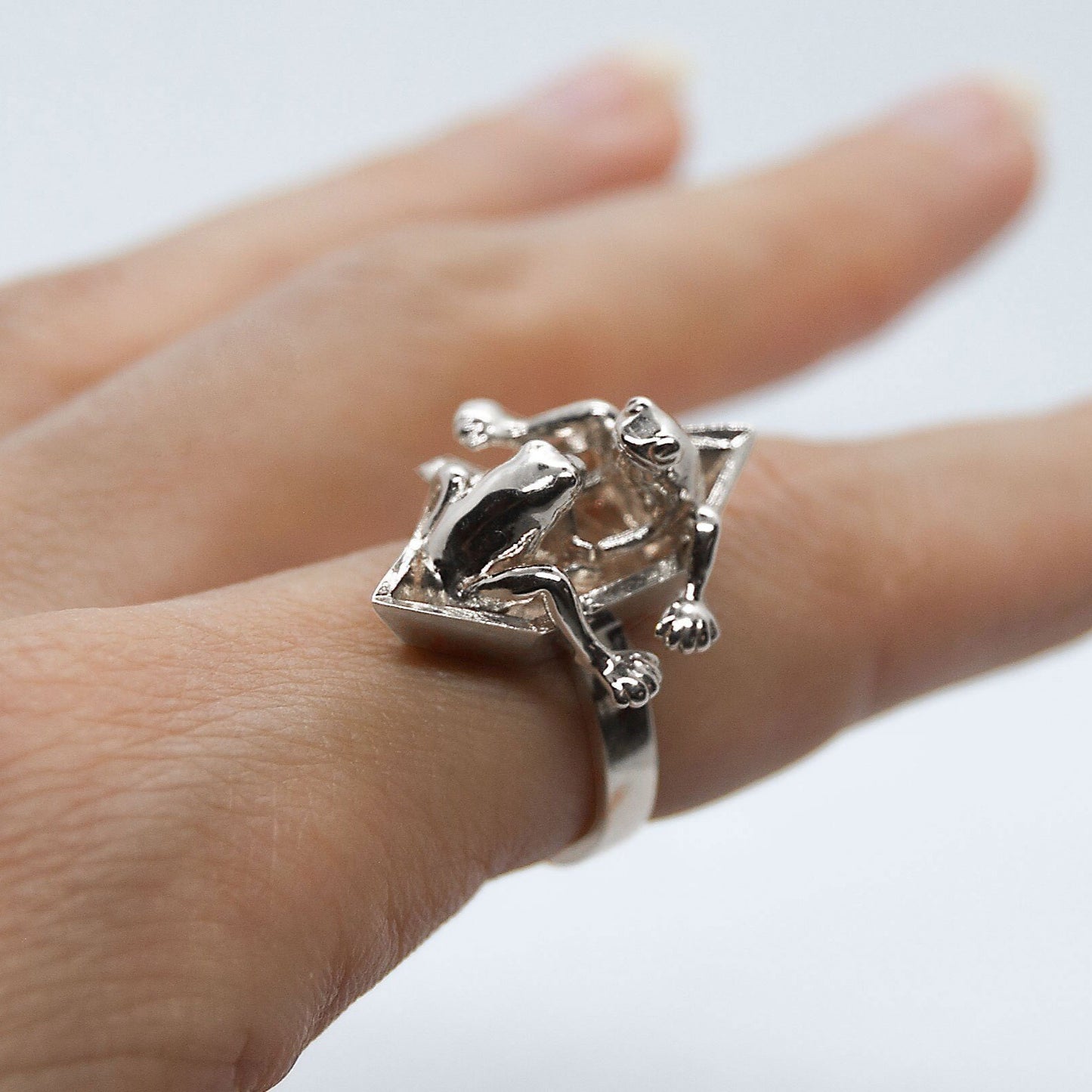 Frogs in origami boat ring